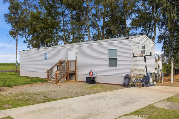 a view of a house with a yard and garage