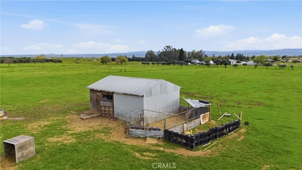 a aerial view of a house with a big yard