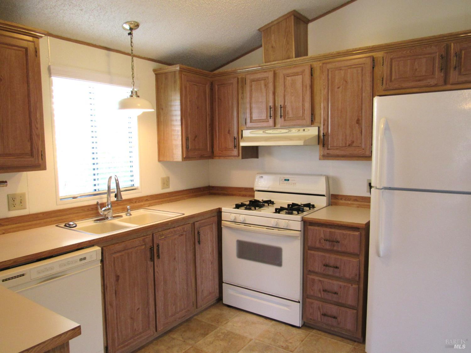 31 Ramon Street Sonoma, CA 95476 - Photo 16 of 24 a kitchen with a stove sink and refrigerator