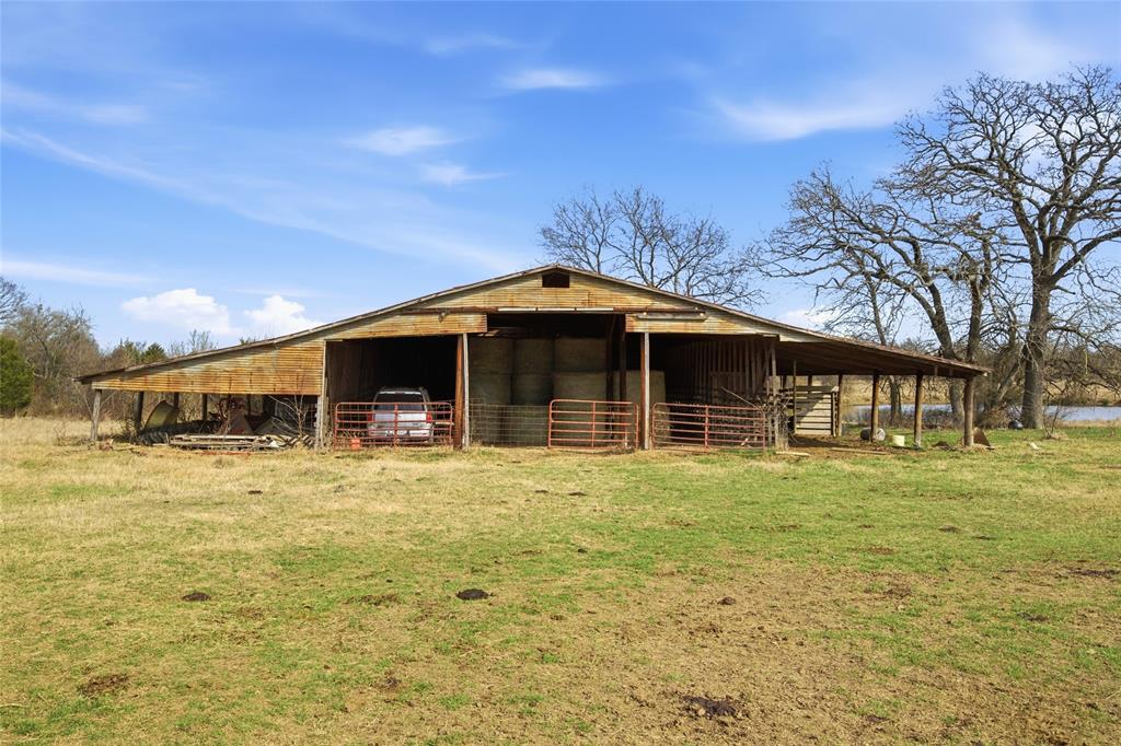 742 County Road 1144 Point, TX 75472 - Photo 22 of 28 a front view of a house with a garden