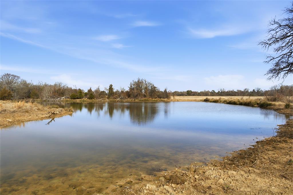 742 County Road 1144 Point, TX 75472 - Photo 24 of 28 a view of a lake with houses in the back