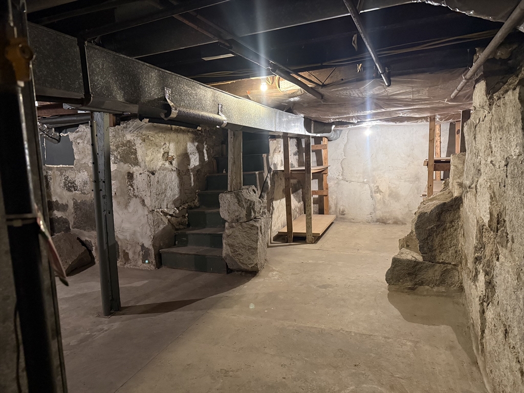 23 Myrtle Street, Unit 2 Quincy, MA 02171 - Photo 12 of 12 a view of empty room with wooden walls