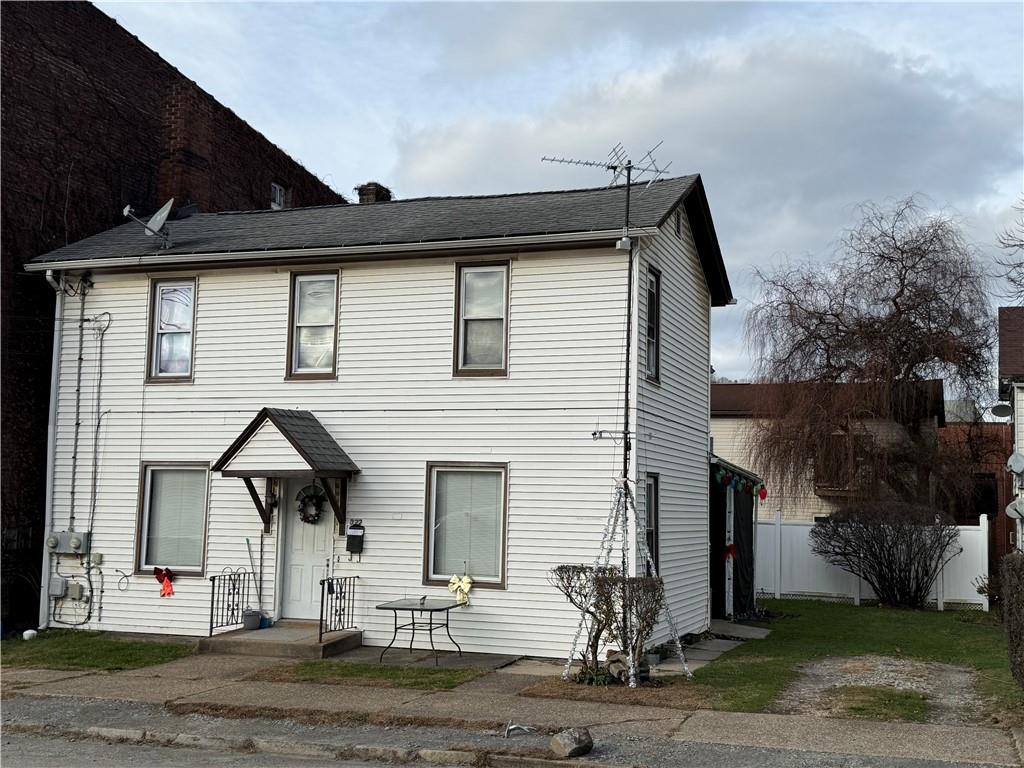 322 North 4th Street Apollo, PA 15613 - Photo 1 of 11 a front view of a house with a garage
