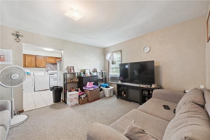 322 North 4th Street Apollo, PA 15613 - Photo 9 of 11 a living room with furniture and a flat screen tv