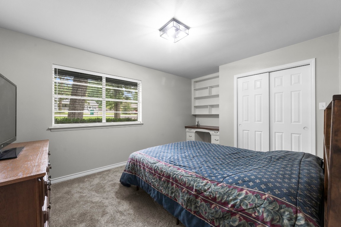 209 Summit Drive Conroe, TX 77303 - Photo 12 of 21 a bedroom with a bed and a window