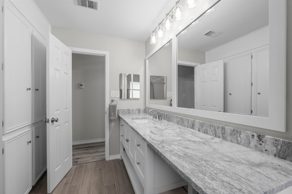 209 Summit Drive Conroe, TX 77303 - Photo 15 of 21 a bathroom with a granite countertop double vanity sink and mirror