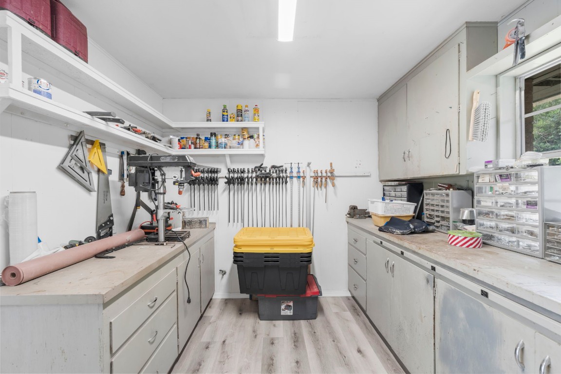 209 Summit Drive Conroe, TX 77303 - Photo 18 of 21 a kitchen that has a lot of cabinets in it