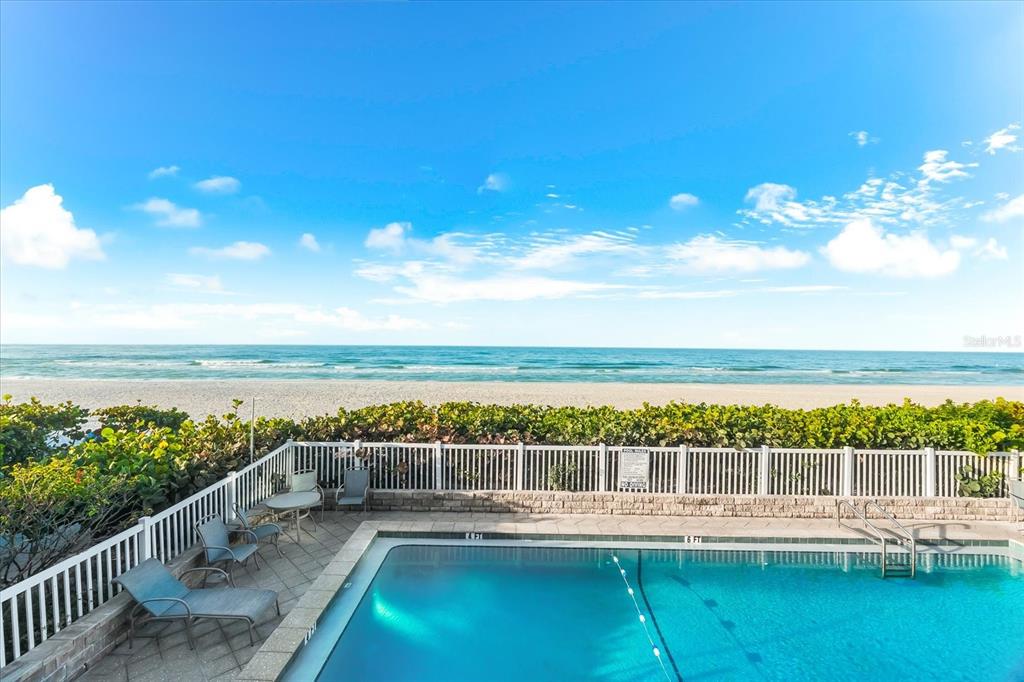 102 68th Street, Unit 102 Holmes Beach, FL 34217 - Photo 3 of 48 a view of an ocean with city