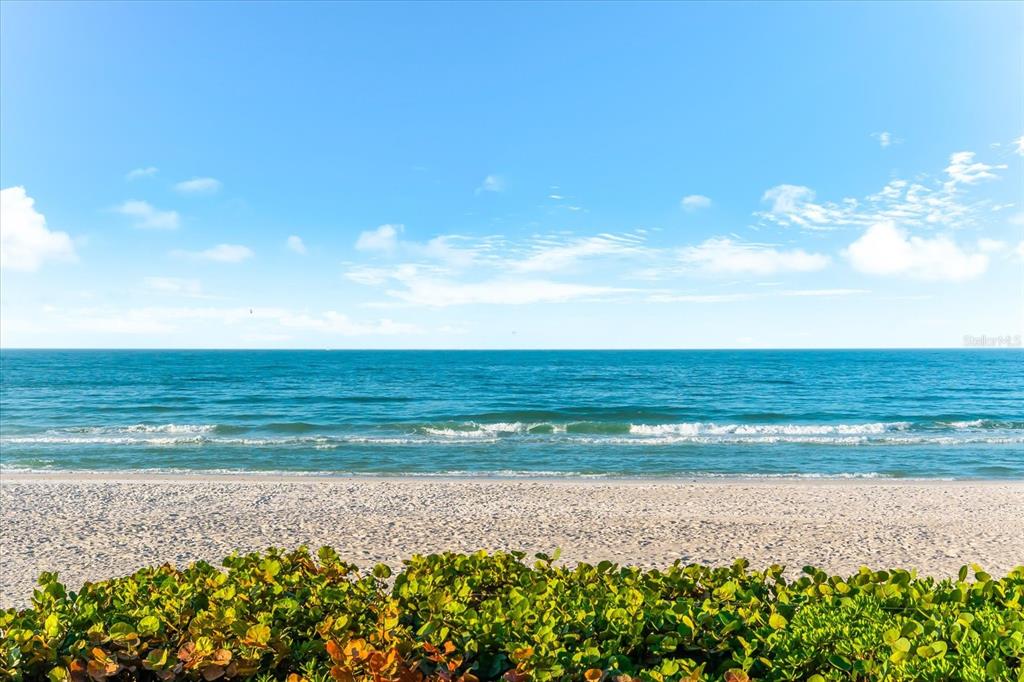 102 68th Street, Unit 102 Holmes Beach, FL 34217 - Photo 31 of 48 a view of an ocean and beach