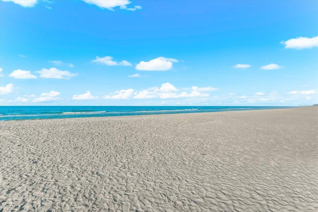 102 68th Street, Unit 102 Holmes Beach, FL 34217 - Photo 34 of 48 a view of an ocean and beach