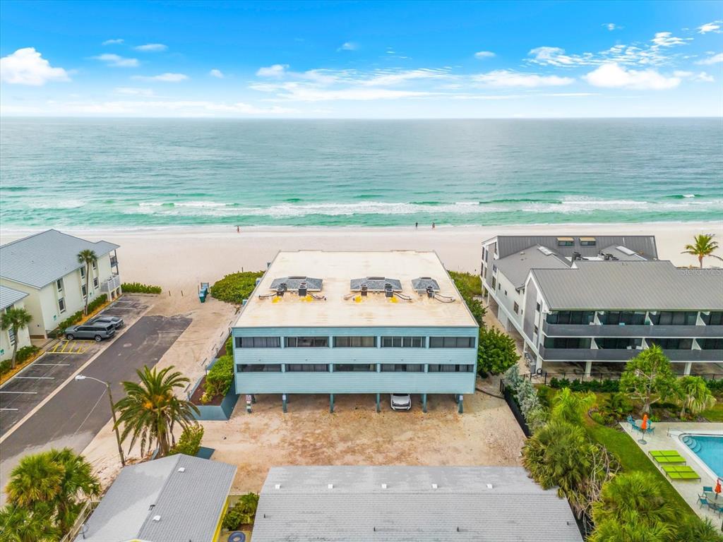 102 68th Street, Unit 102 Holmes Beach, FL 34217 - Photo 37 of 48 a view of a swimming pool with an outdoor seating