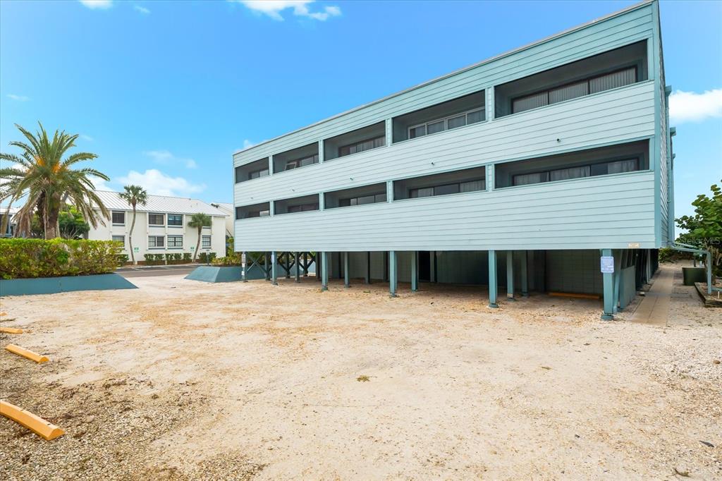 102 68th Street, Unit 102 Holmes Beach, FL 34217 - Photo 39 of 48 a house with a outdoor space