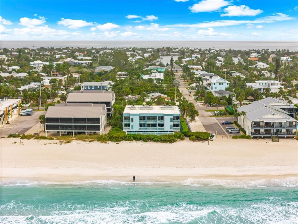 102 68th Street, Unit 102 Holmes Beach, FL 34217 - Photo 44 of 48 an aerial view of residential building and ocean
