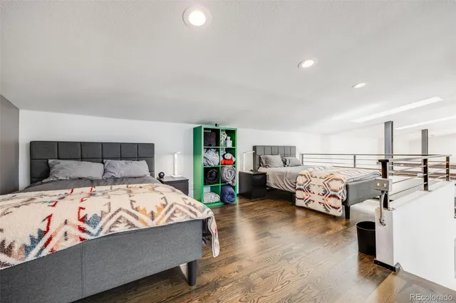a view of a patio with table and chairs potted plants with floor to ceiling window and wooden fence