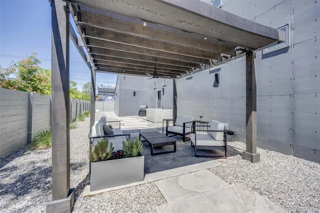 an aerial view of multiple houses with yard