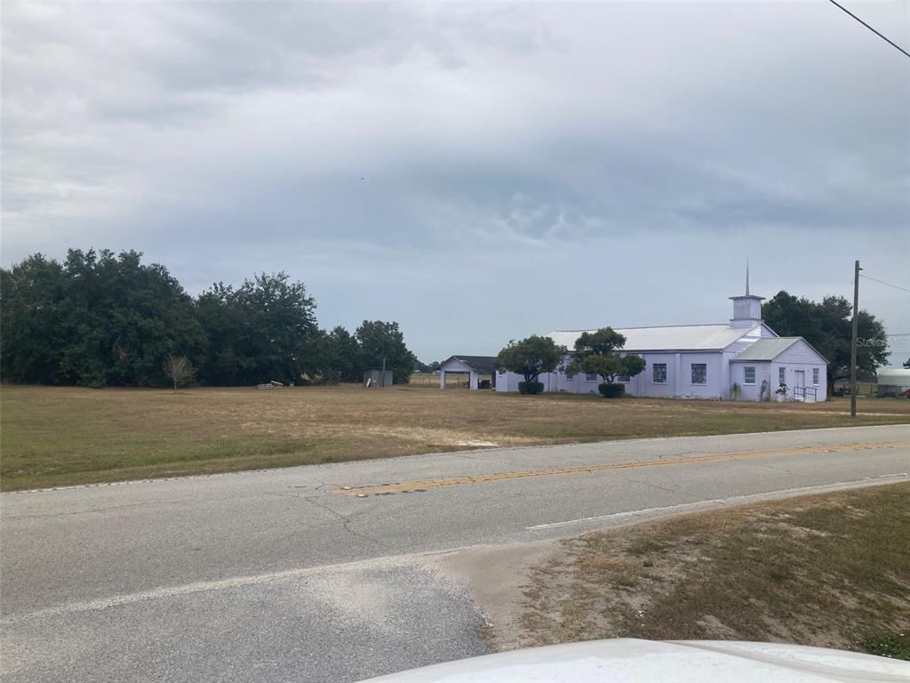 3231 Mountain Lake Cutoff Road Lake Wales, FL 33859 - Photo 3 of 6 a view of a town with big trees