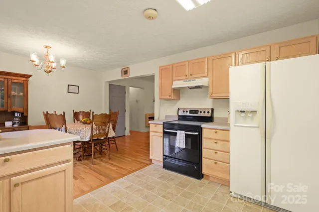 a kitchen with a cabinets and appliances