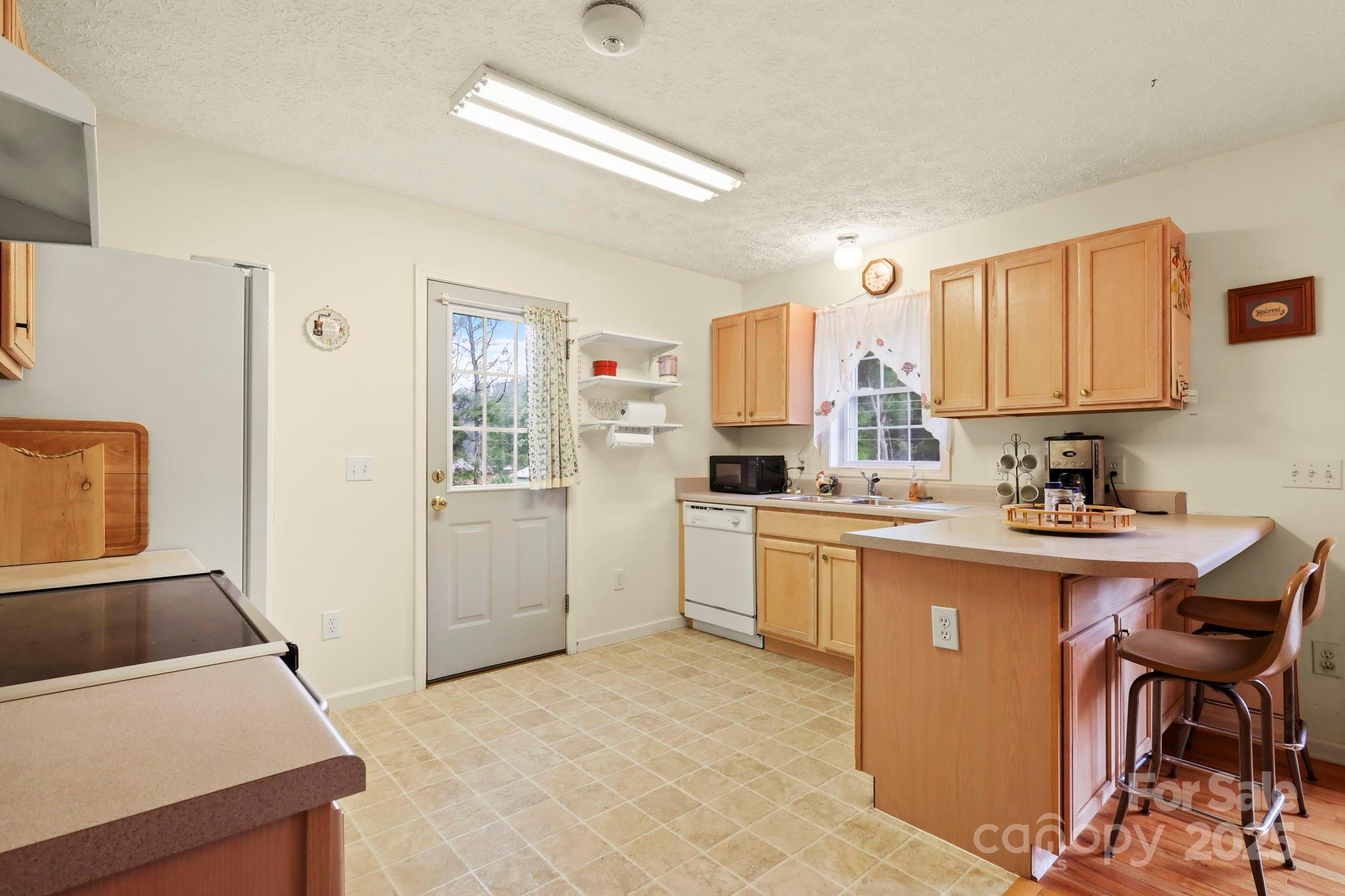 31 Barlow Road Elk Park, NC 28622 - Photo 17 of 40 a kitchen with a cabinets and appliances