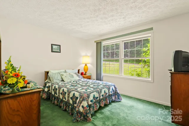 a bedroom with a bed and furniture