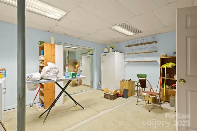 a bed room with a bed and a chair