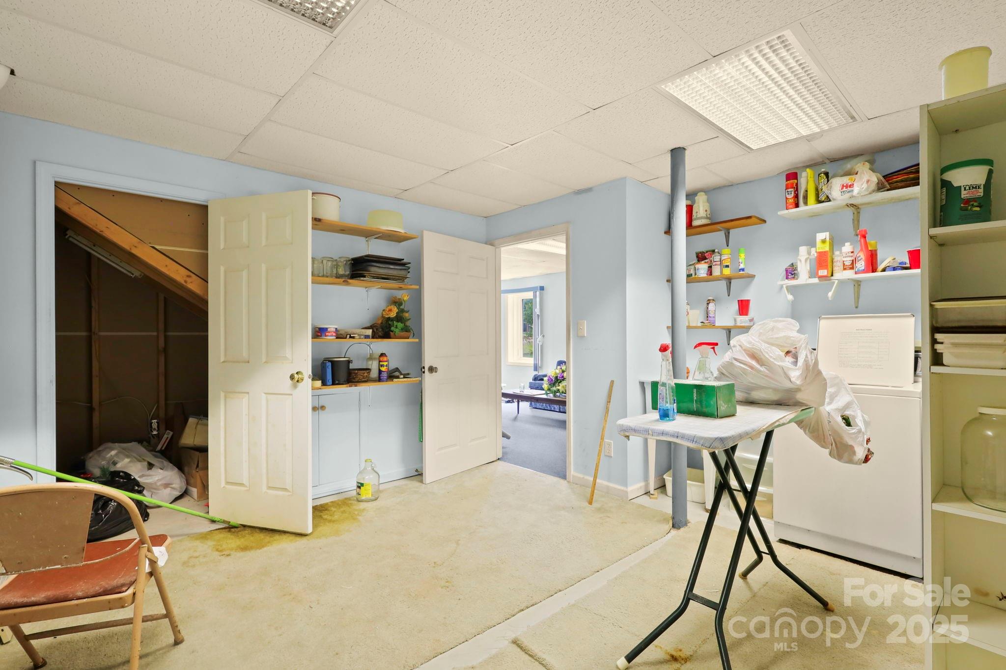 31 Barlow Road Elk Park, NC 28622 - Photo 34 of 40 a bed room with a bed and a chair