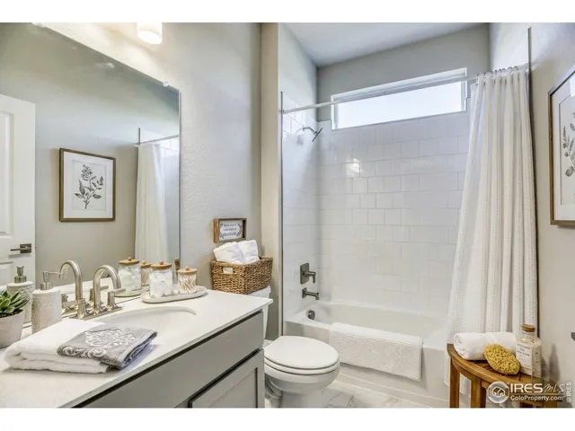 a bedroom with a bed and a desk