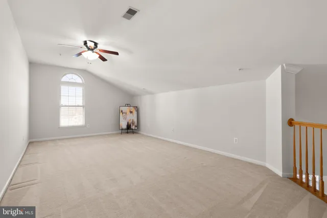 a view of empty room with windows