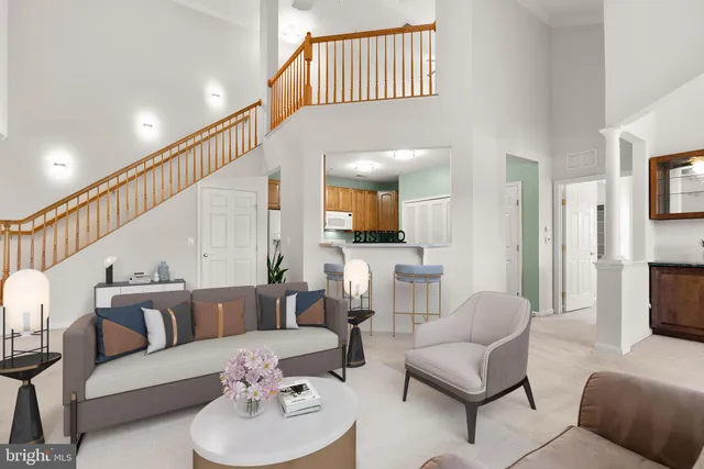 a living room with furniture or couch and a kitchen