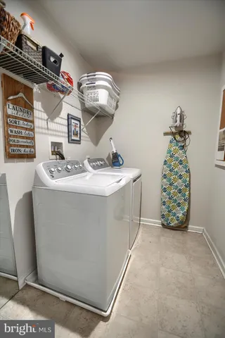 a bathroom with a sink a mirror and shower