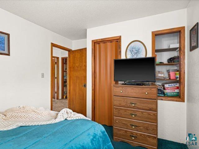 3616 Lavaque Road Hermantown, MN 55811 - Photo 29 of 43 Bedroom featuring white painted walls and wood-finish door frames