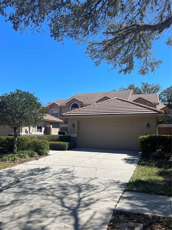17543 Fairmeadow Drive Tampa, FL 33647 - Photo 1 of 1 a front view of a house with a yard