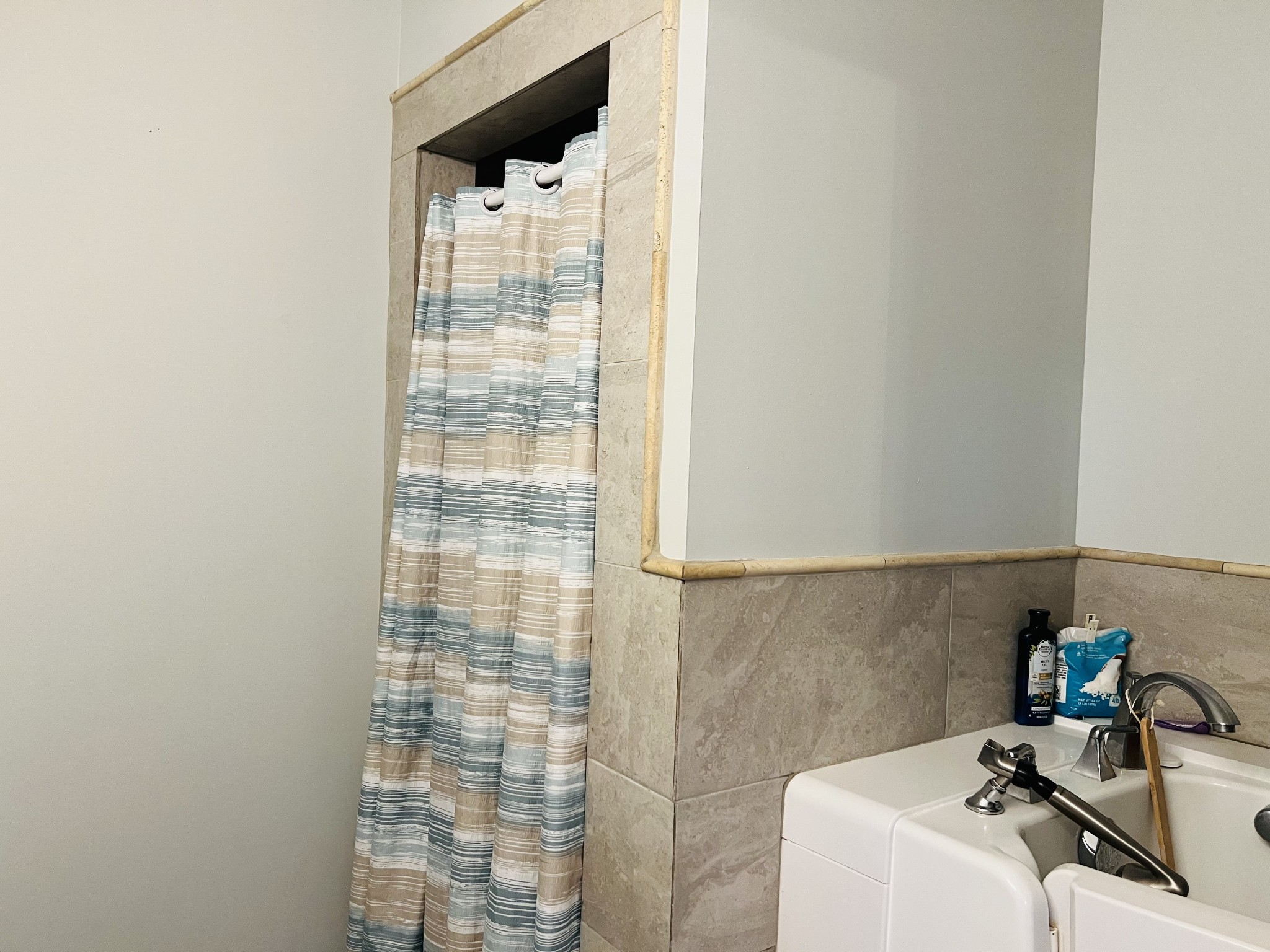 106 Wells Lee Road Elora, TN 37328 - Photo 17 of 33 A separate shower and walk-in tub with tile surround provide easy access for all.