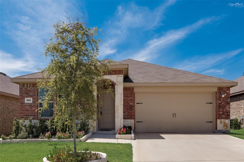809 Costlow Lane Fate, TX 75189 - Photo 2 of 29 a front view of a house with a yard