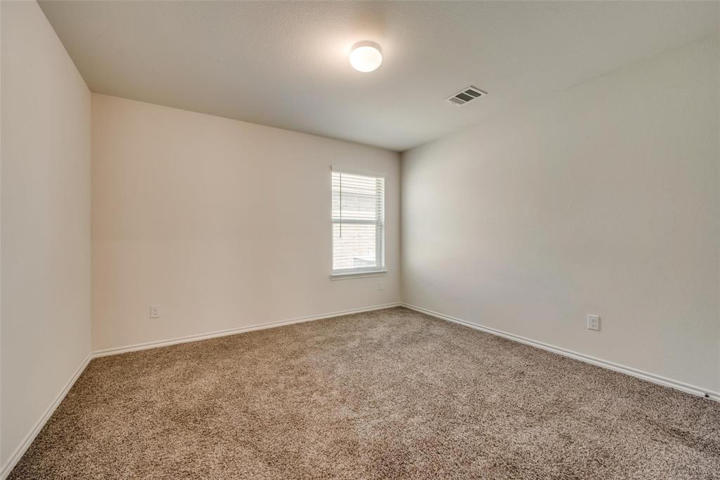 809 Costlow Lane Fate, TX 75189 - Photo 23 of 29 an empty room with a window