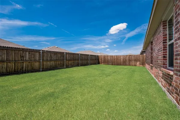 a view of yard with porch and a yard
