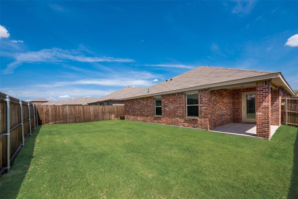 809 Costlow Lane Fate, TX 75189 - Photo 28 of 29 a front view of a house with a yard