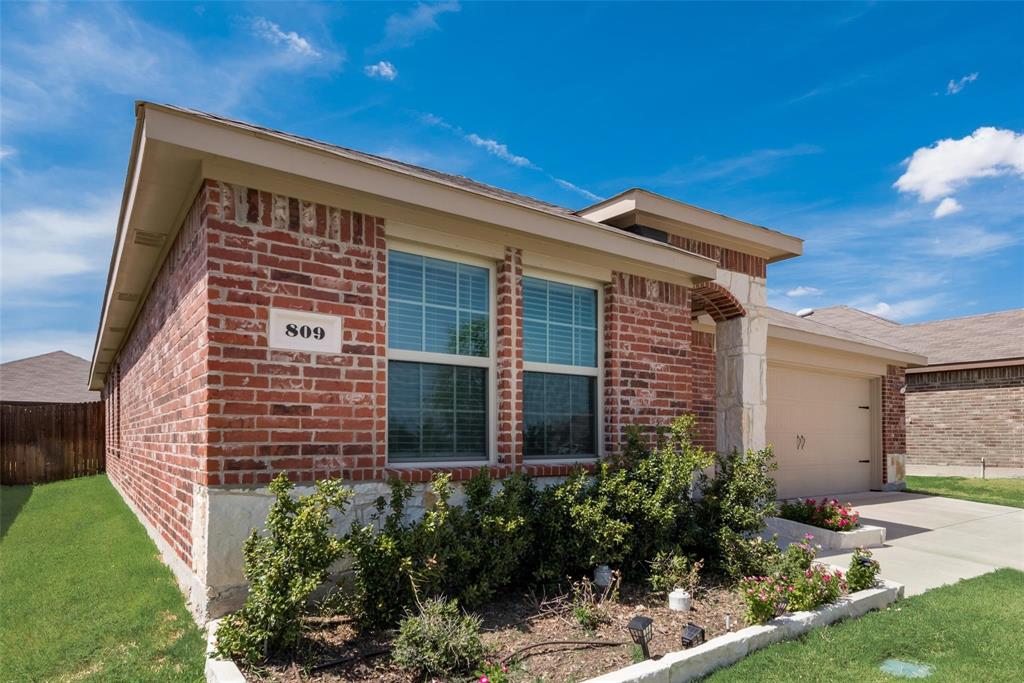 809 Costlow Lane Fate, TX 75189 - Photo 4 of 29 a front view of a house with garden