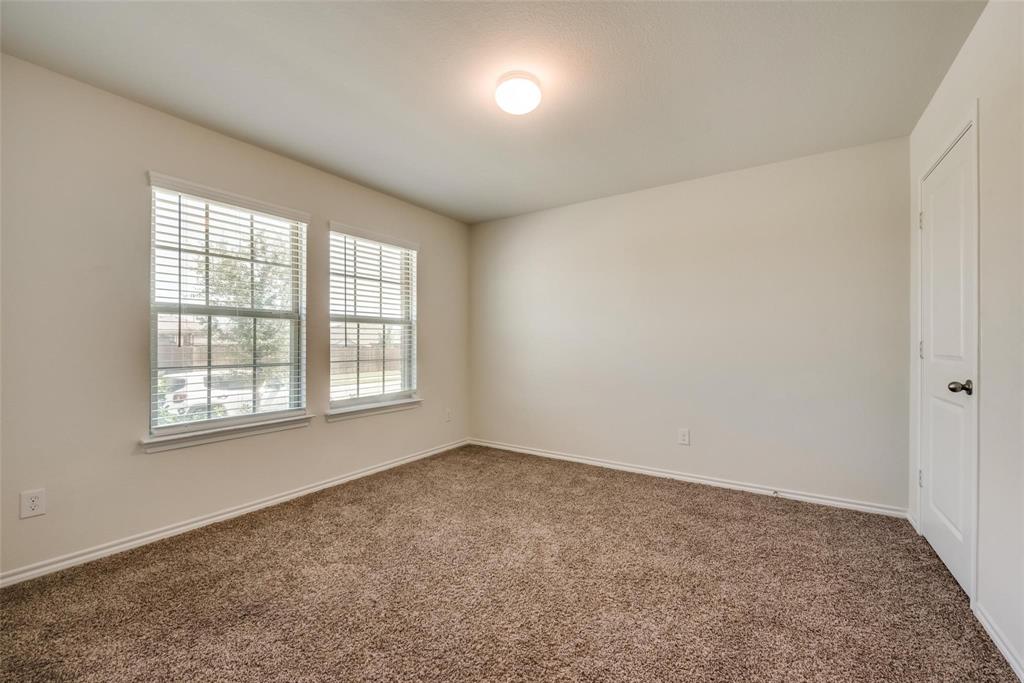 809 Costlow Lane Fate, TX 75189 - Photo 5 of 29 an empty room with a window