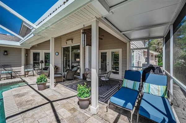 an aerial view of house with yard swimming pool and outdoor seating