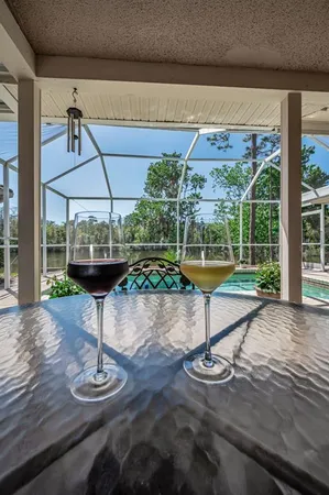 a view of a swimming pool with a patio