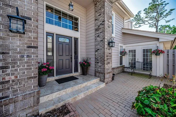 a large kitchen with stainless steel appliances granite countertop a lot of counter space and a sink
