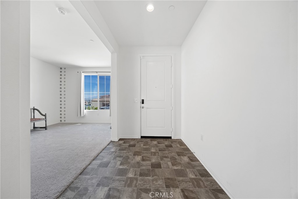 27059 Indigo Bush Road Menifee, CA 92586 - Photo 11 of 39 Light-Filled Entry Room With Neutral Finishes And Flexible Use