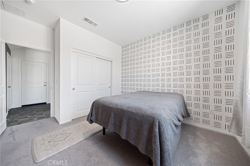 27059 Indigo Bush Road Menifee, CA 92586 - Photo 19 of 39 Primary Floor Bedroom With Natural Light And Clean Finishes