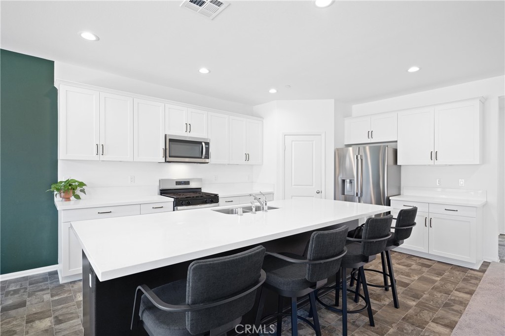 27059 Indigo Bush Road Menifee, CA 92586 - Photo 2 of 39 Bright Kitchen Featuring Large Center Island And Bar Seating