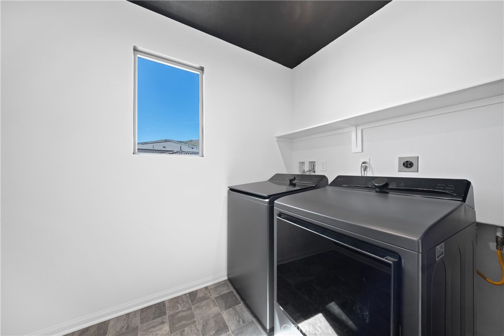 27059 Indigo Bush Road Menifee, CA 92586 - Photo 23 of 39 Upstairs Laundry Room With Built-In Storage Shelf