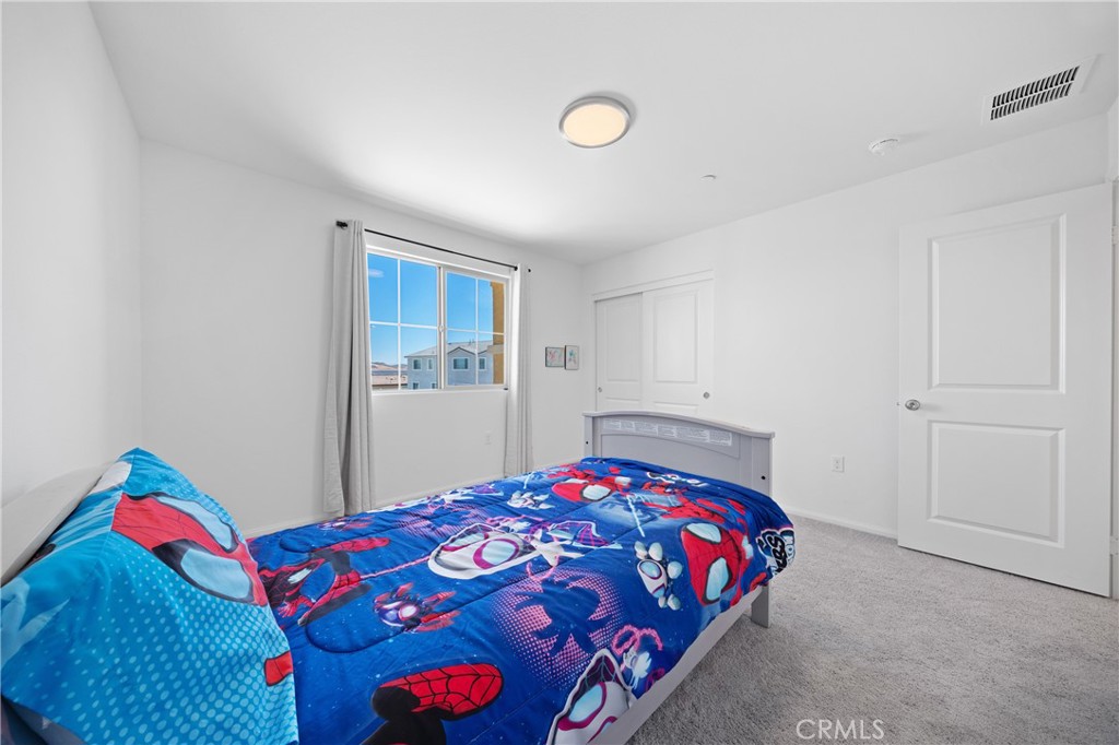 27059 Indigo Bush Road Menifee, CA 92586 - Photo 27 of 39 Bedroom With Neutral Finishes And Natural Light