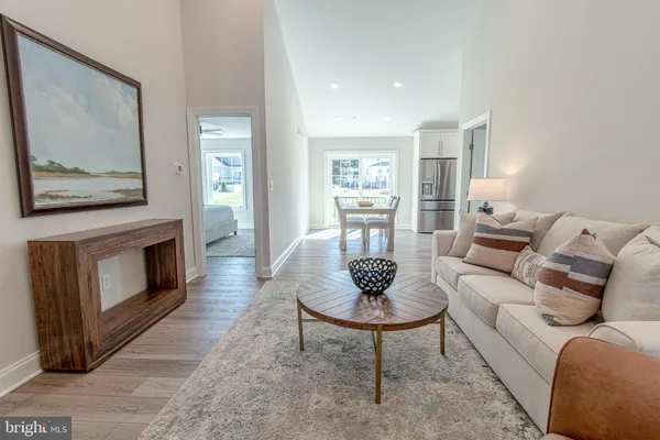 a living room with furniture a rug and a fireplace