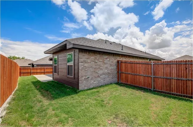 a backyard of a house with lots of green space