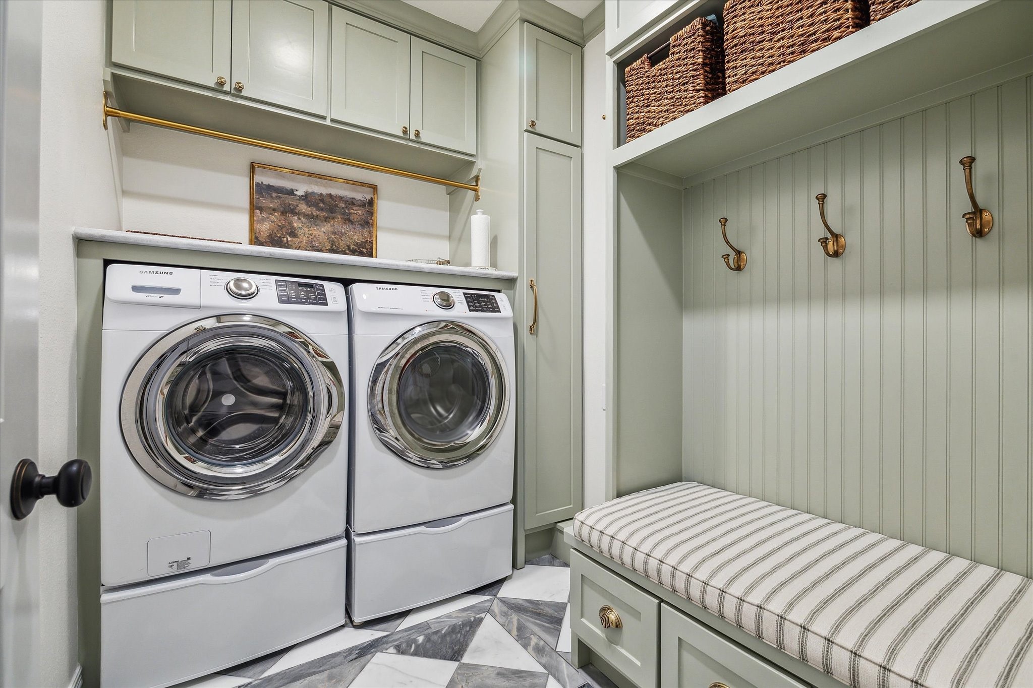 1515 Thornton Road Houston, TX 77018 - Photo 25 of 39 The freshly remodeled mudroom featuring marble flooring and custom built-ins is conveniently located just off garage entrance.