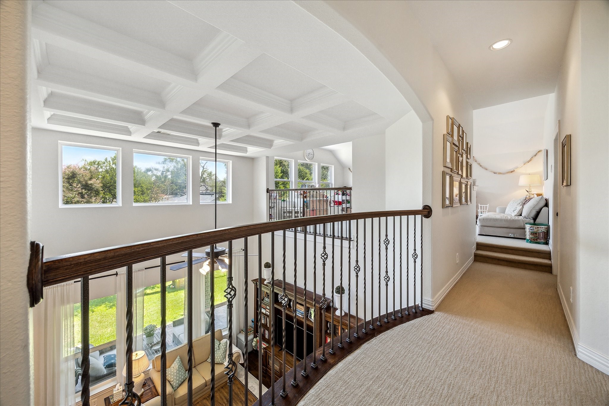 1515 Thornton Road Houston, TX 77018 - Photo 30 of 39 A key highlight of this home is the open second-level corridors, full of natural light creating a clever visual connection to the separated lower levels. This rear-facing corridor is flanked by the home's upper-level entertaining spaces and another set of secondary bedrooms with a secondary full bathroom.